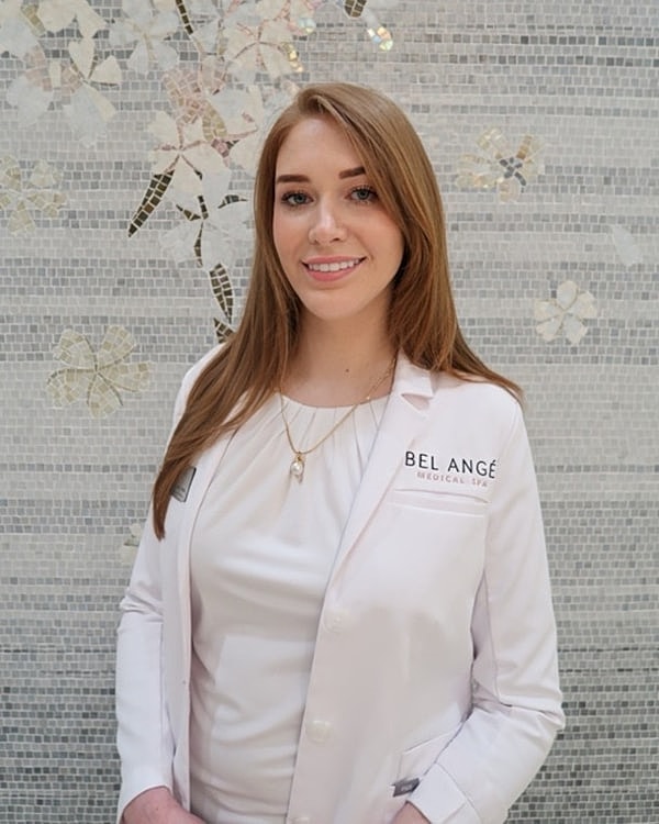 Professional woman in medical spa setting.